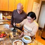 Angel Kowalski (left) prepares meals for the week with his wife. Angel is a cancer survivor and worked with a dietitian at The Ohio State University Comprehensive Cancer Center—Arthur G. James Cancer Hospital and Richard J. Solove Research Institute to learn about foods that combat chronic fatigue, the most common long-term side effect of cancer treatment.