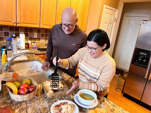 Angel Kowalski (left) prepares meals for the week with his wife. Angel is a cancer survivor and worked with a dietitian at The Ohio State University Comprehensive Cancer Center—Arthur G. James Cancer Hospital and Richard J. Solove Research Institute to learn about foods that combat chronic fatigue, the most common long-term side effect of cancer treatment.